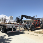 Unloading new equipment at our Monterey County sign company