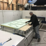 Cutting out a custom sign from green foam