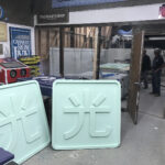 Custom commercial signage being prepared in green foam
