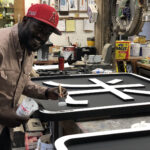 Sign painting for a custom sign