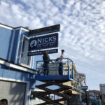 Commercial signage for Nick's On the Bay restaurant