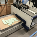 Our machine making a custom business sign for Lyft