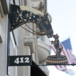 Custom metal signage featuring a horse and dog
