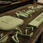 Custom signage made out of green foam