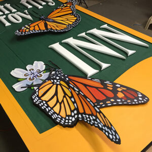 A custom sign with bright butterflies on it